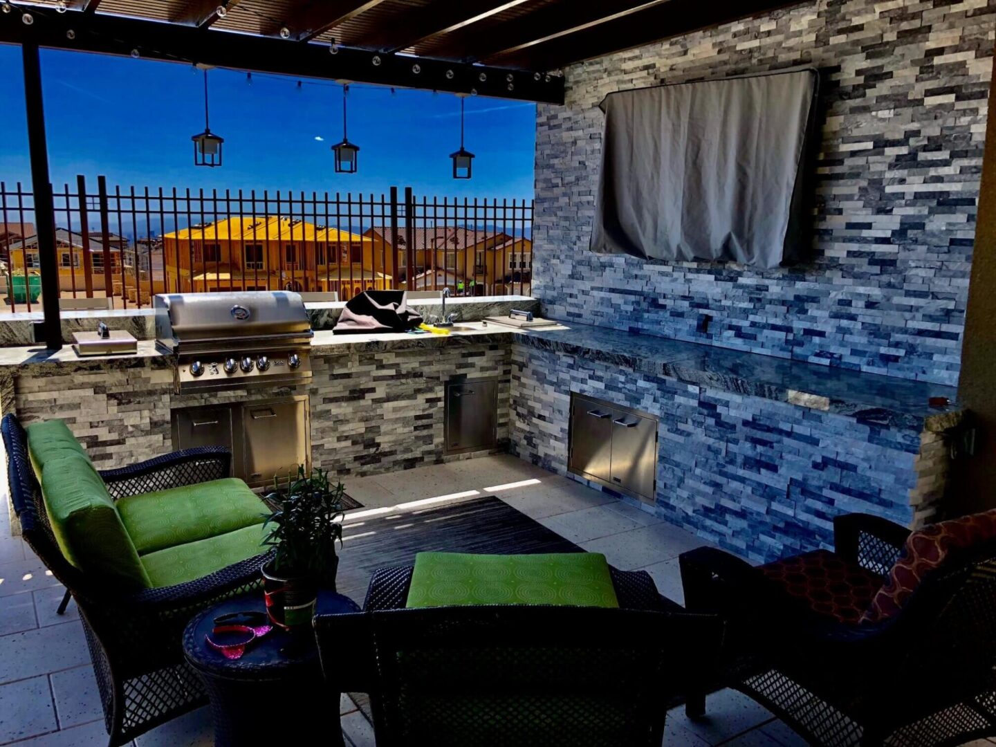 A patio with a fireplace and outdoor furniture.
