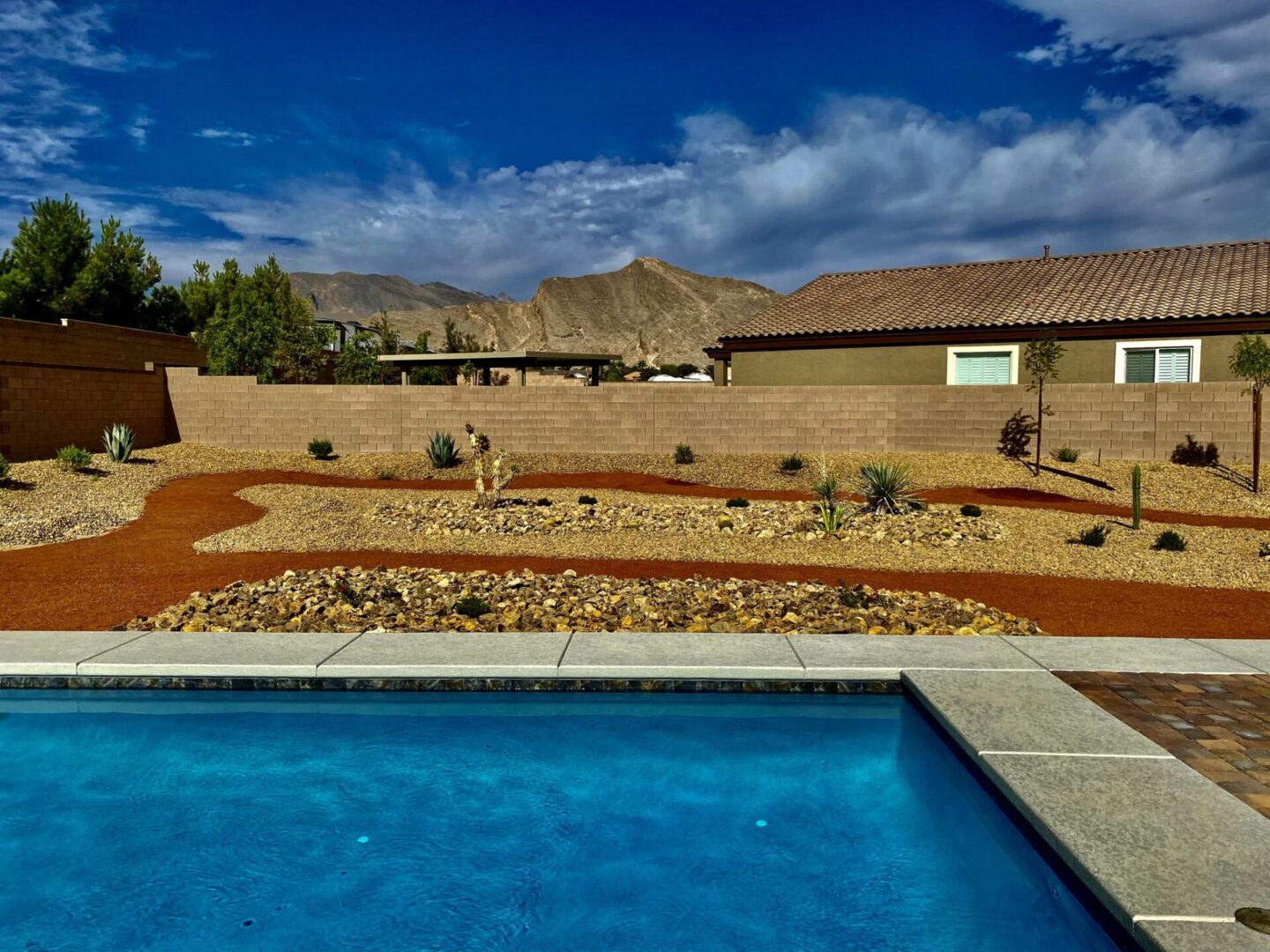 A pool with a view of the desert.